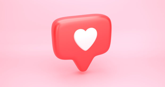 white heart in red caption on pink background